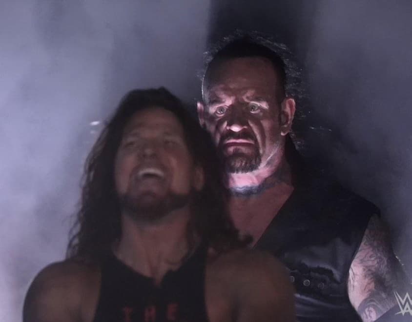 Undertaker Standing Behind AJ Styles meme template