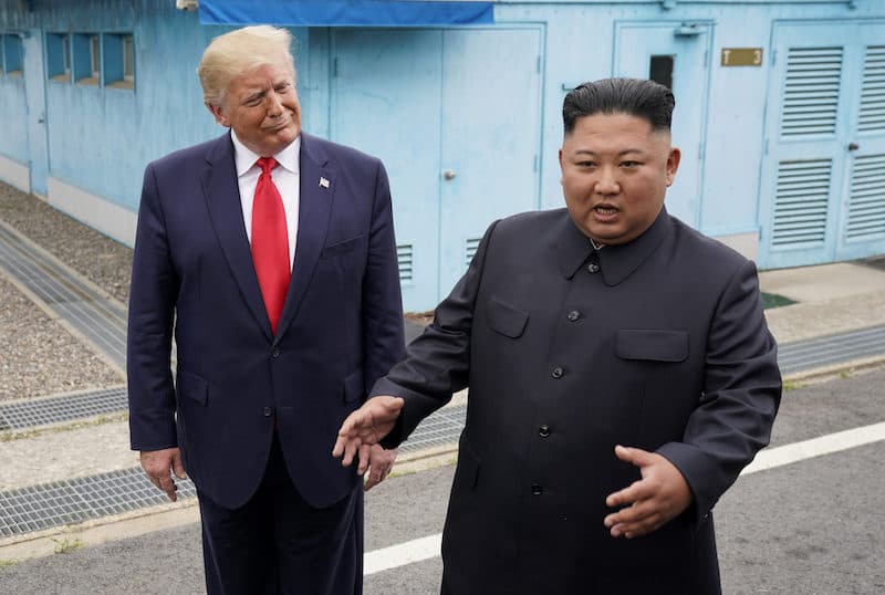 Trump and Kim Jong Un in the DMZ meme template