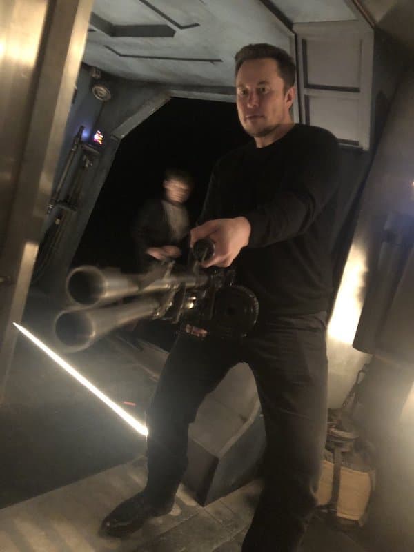 Elon Musk Holding a Minigun meme template